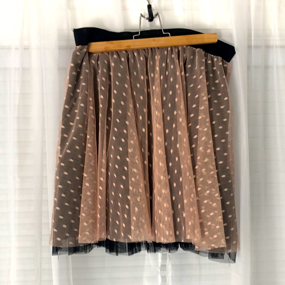 Tule, elastic waist skirt, knee length.